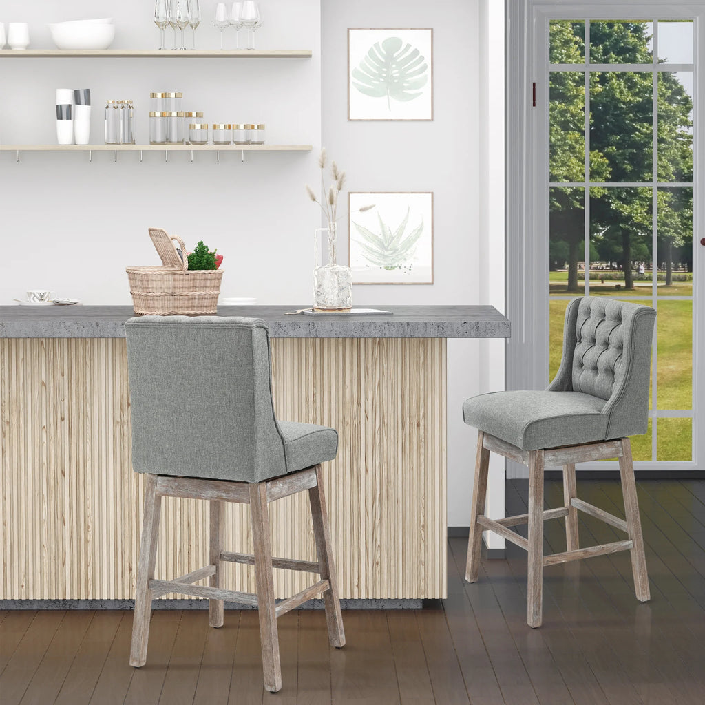 Brynleigh gray bar stools shown from front and back at a kitchen bar