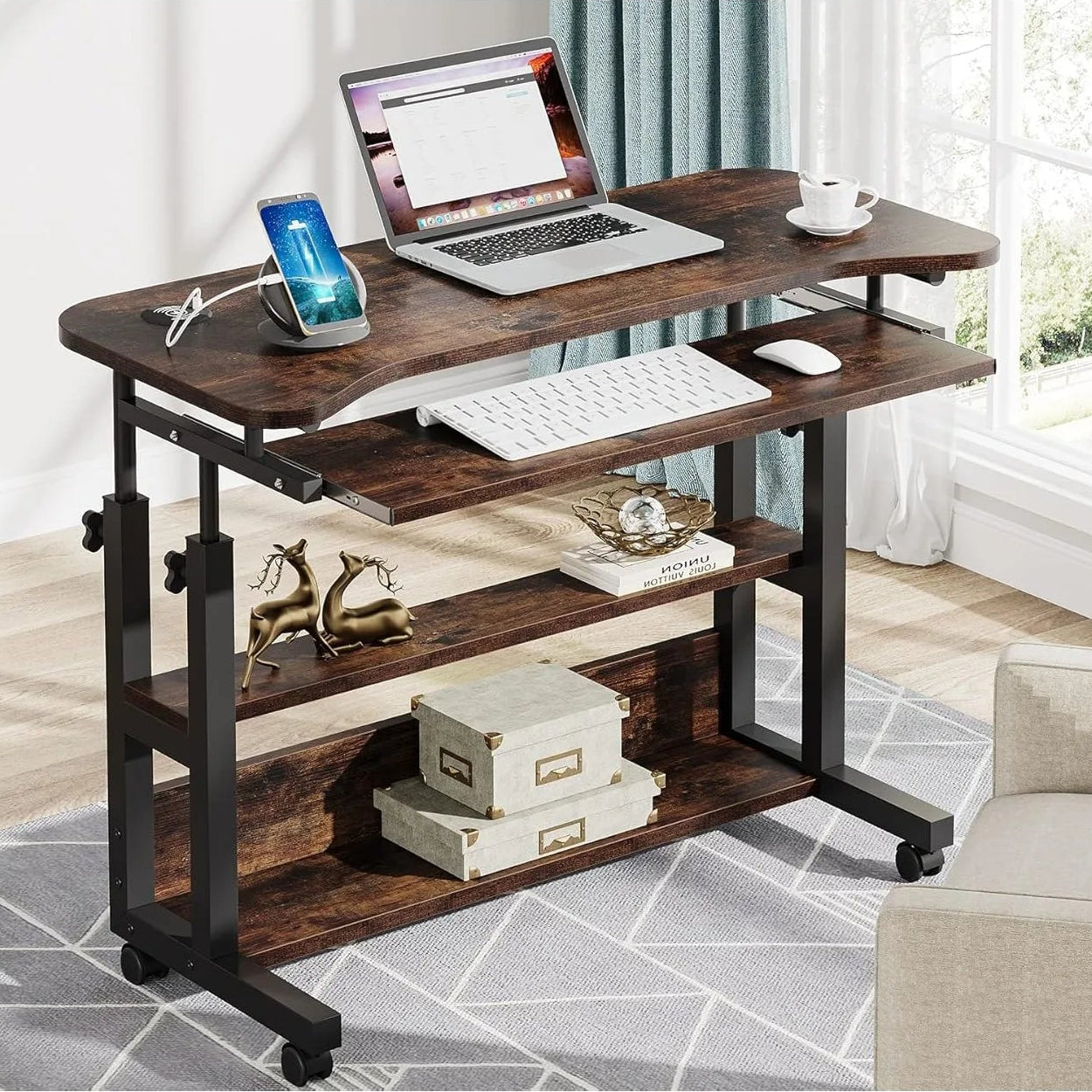 Wooden desk with laptop, keyboard, and other items in a home office setting.