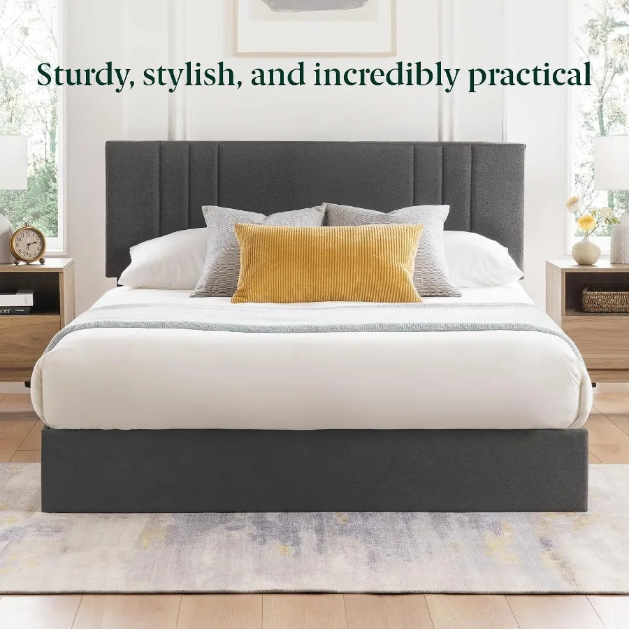 Straight-on bedroom image highlighting the dark gray paneled headboard and matching footboard.