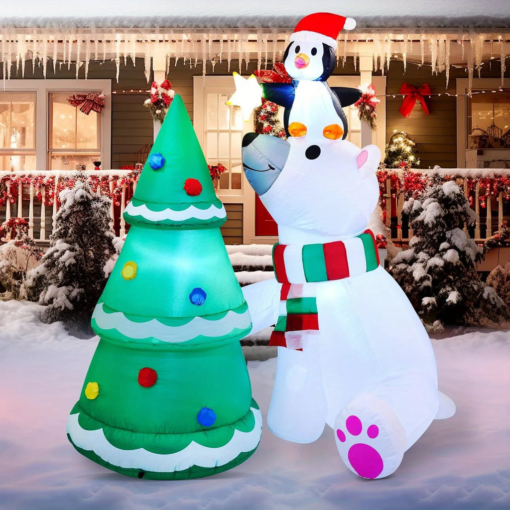 Treestar polar bear supporting a penguin holding a star beside a Christmas tree.