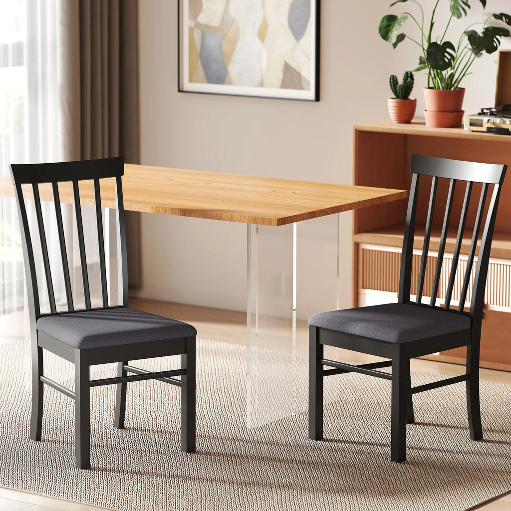 Two Novacrest black and gray chairs beside a rectangular dining table