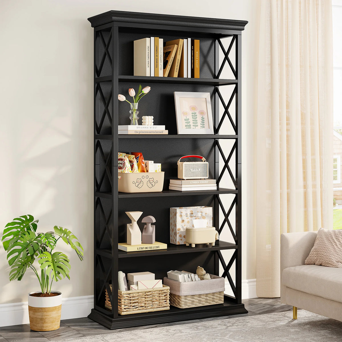 Black bookshelf with decorative items in a living room setting