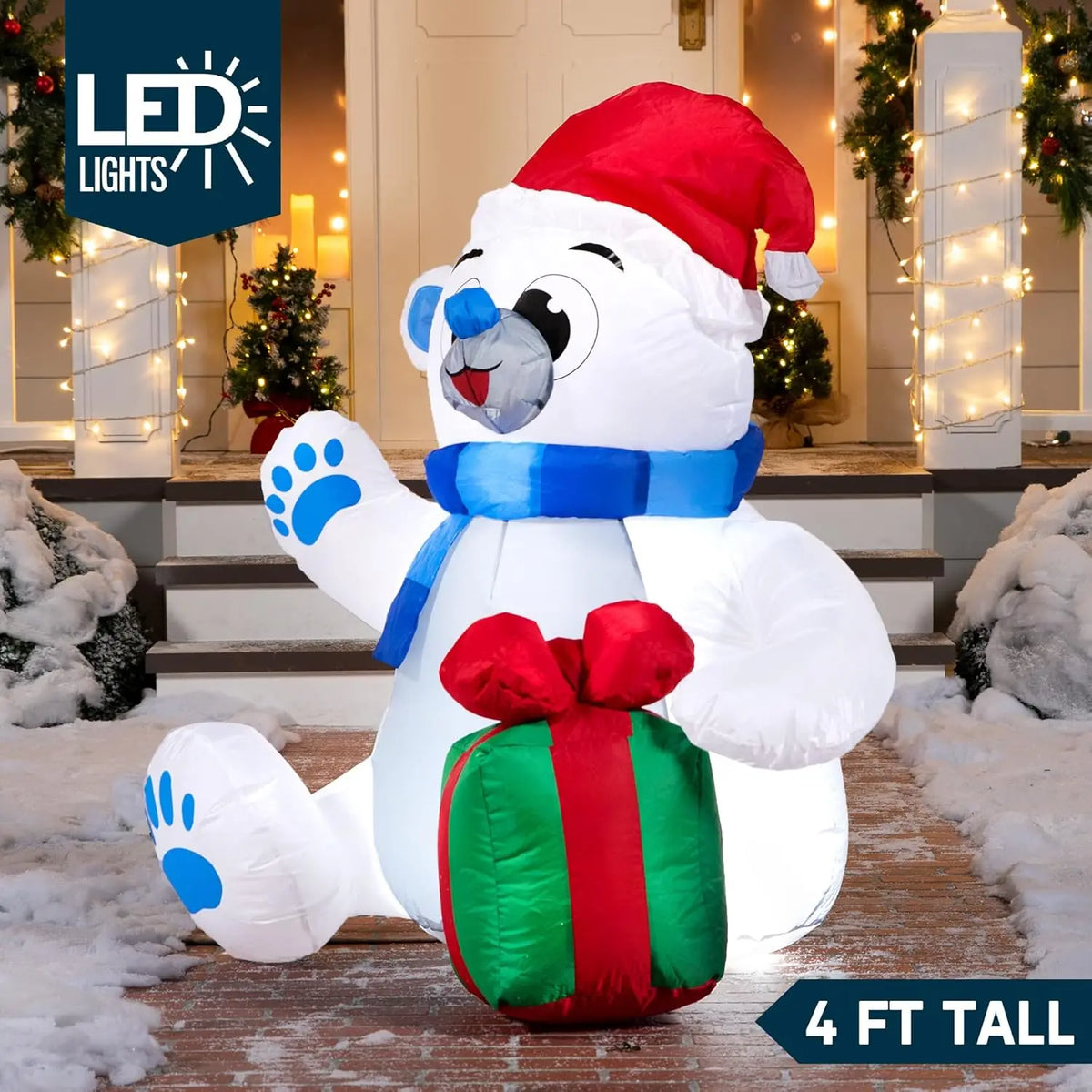 Giftpaw polar bear Christmas inflatable illuminated at night with a four-foot height label.