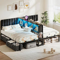 Two twin beds with upholstered headboards and central illuminated storage divider