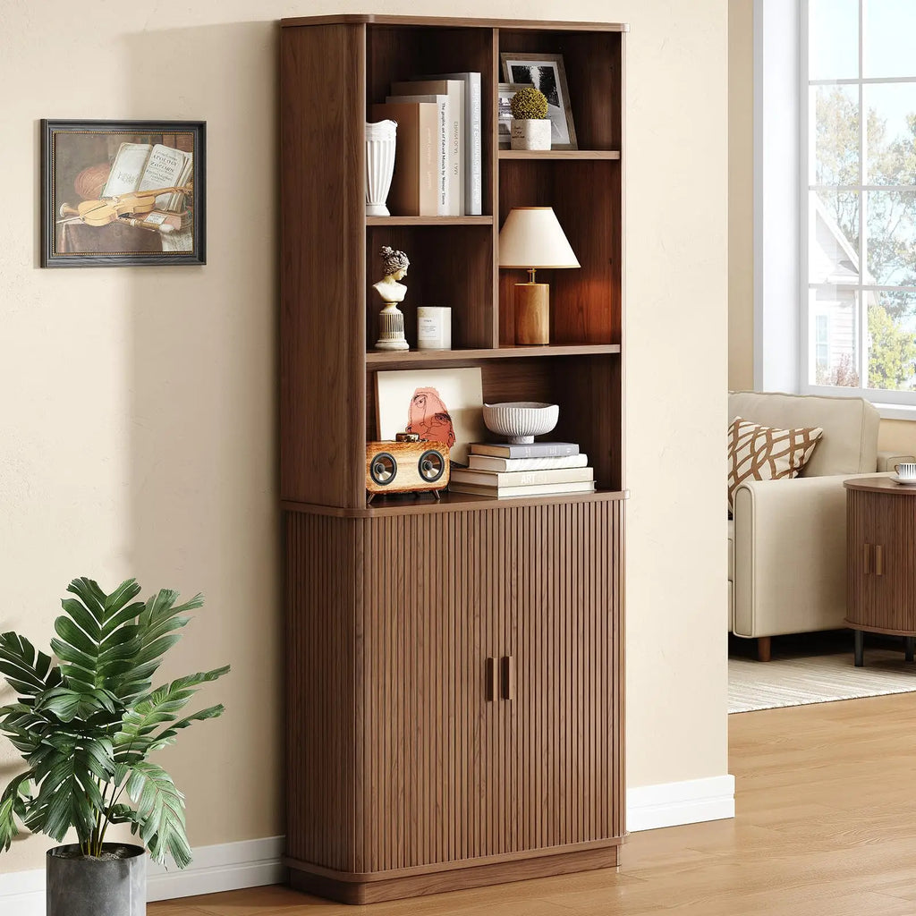 Brown Hushbloom bookcase on its full-width pedestal base in a living room