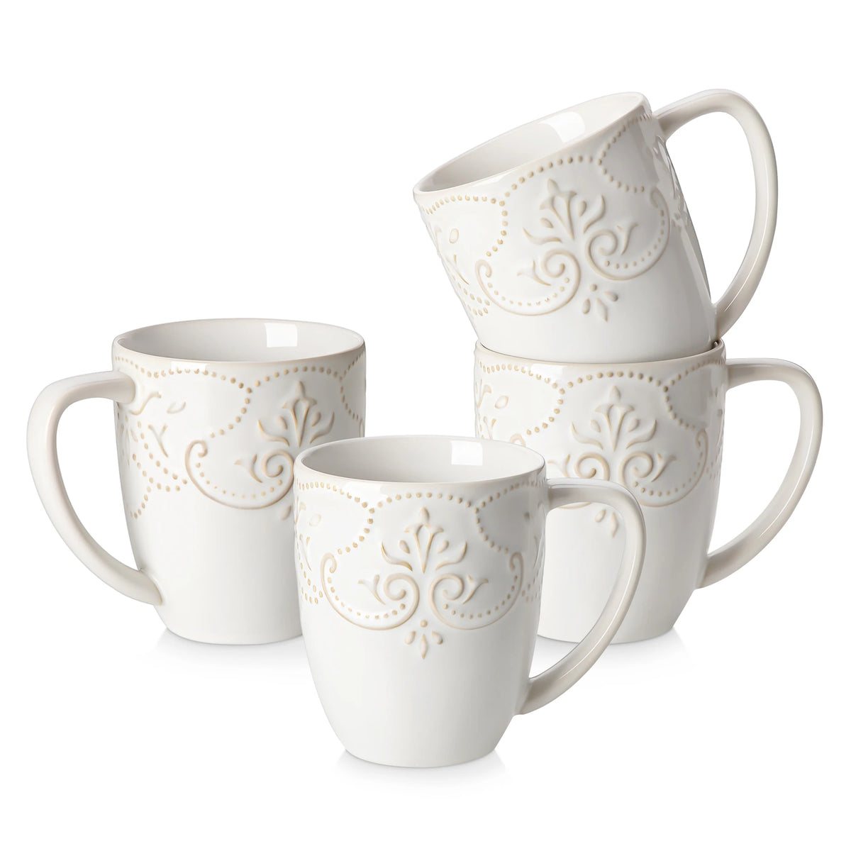 Four white GISELLE mugs with floral scroll relief and tall handles arranged on a white background