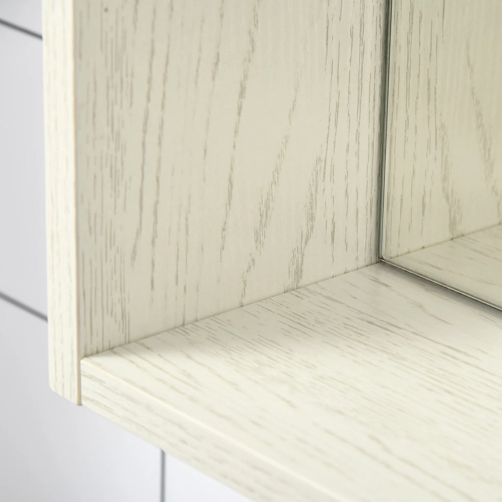 Close-up of Silhouettewhisper's white wood-grain frame, shelf and mirrored edge