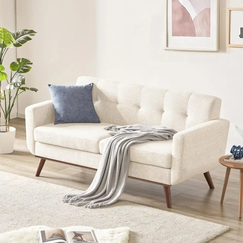 Embercoast beige tufted two-seat loveseat with wood-tone legs in living room