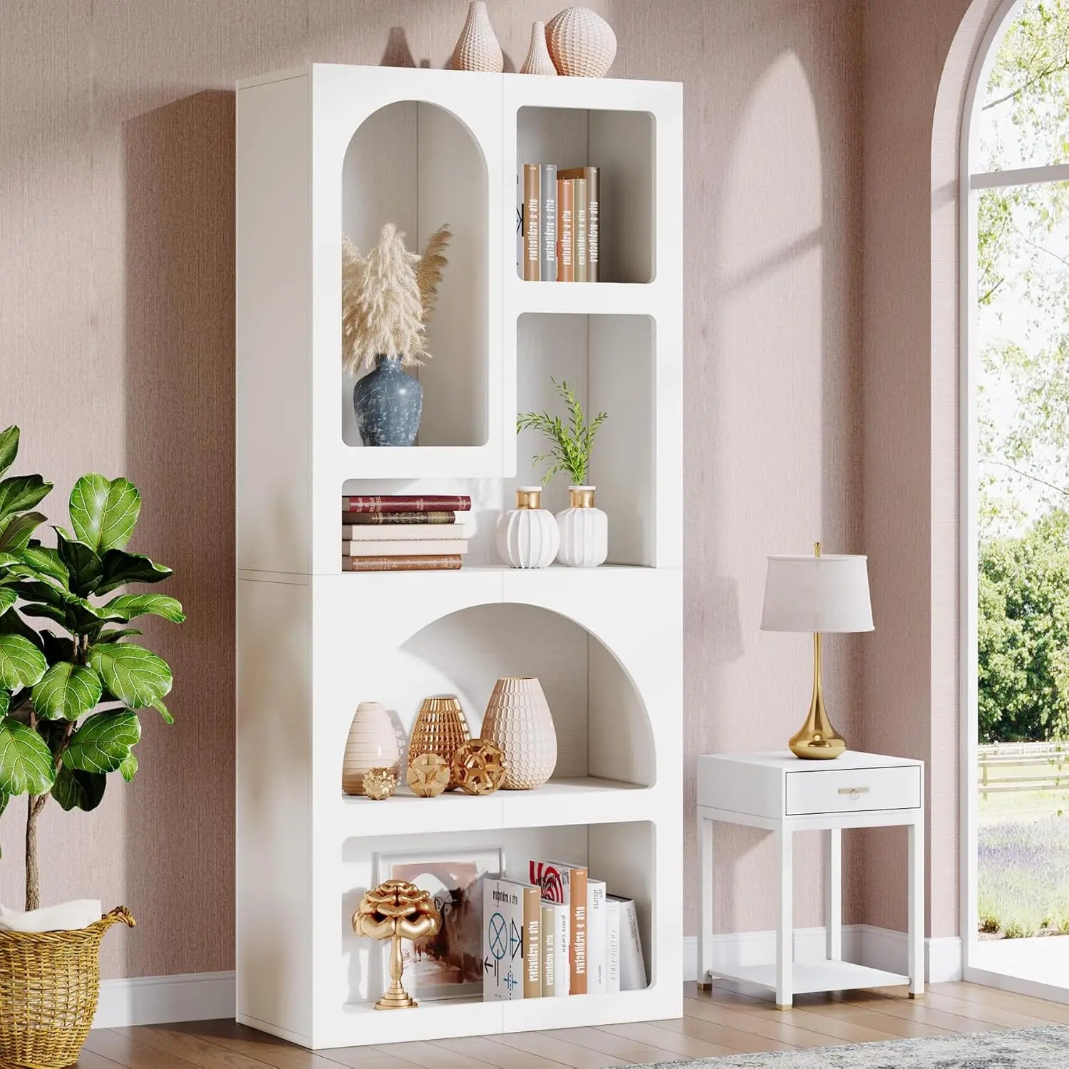 White bookshelf with decorative items in a room with a lamp and plant.