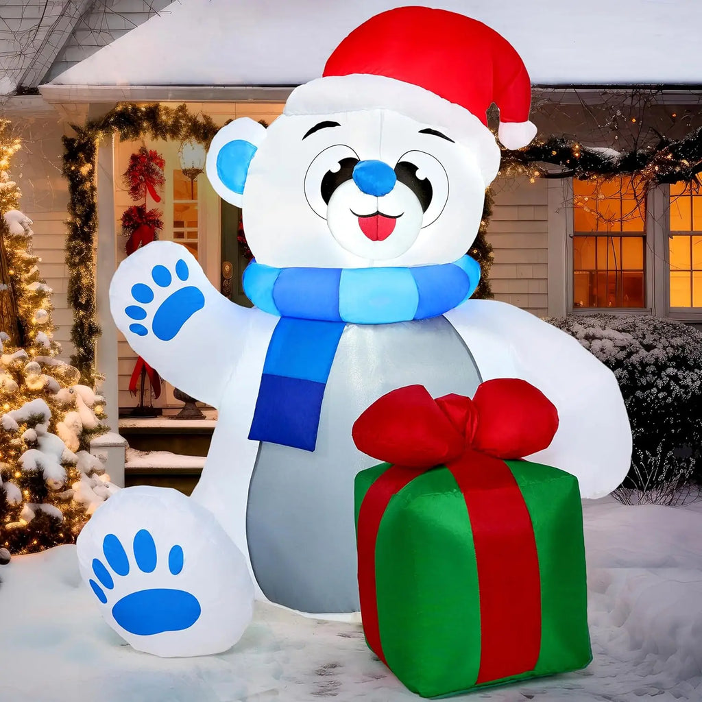 Giftpaw seated polar bear inflatable with raised paw, Santa hat, blue scarf and green gift.