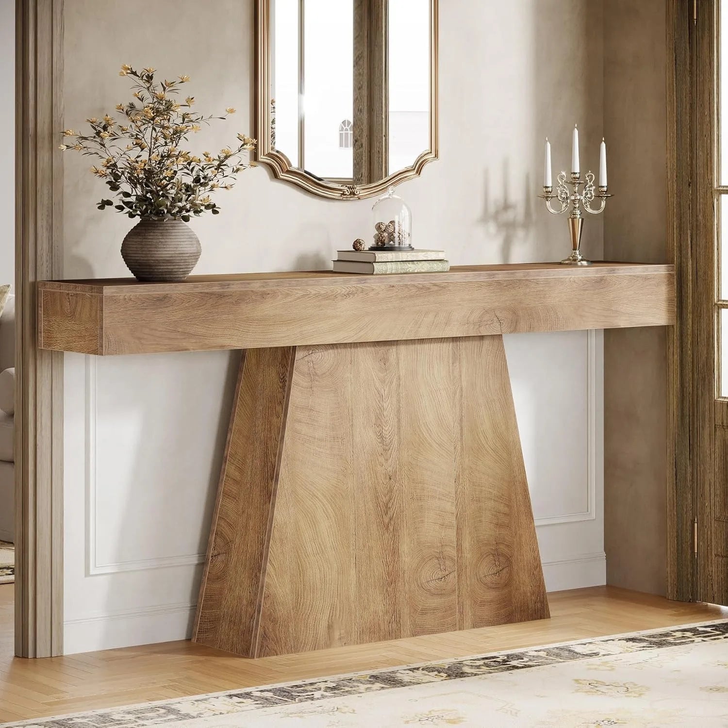 Wooden console table with decorative items in a room setting