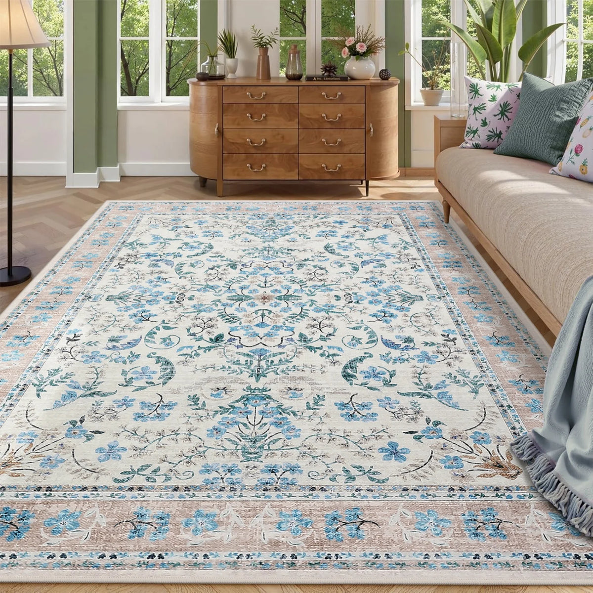 Meadowlark Blue floral area rug styled in a living room