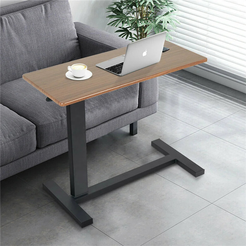 Height-adjustable side table with an offset black metal support for sofa-side laptop use