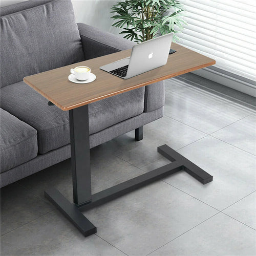 Height-adjustable side table with an offset black metal support for sofa-side laptop use