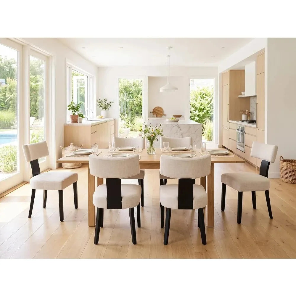 Sevrin dining chairs with curved backs and armless seats in a bright kitchen setting
