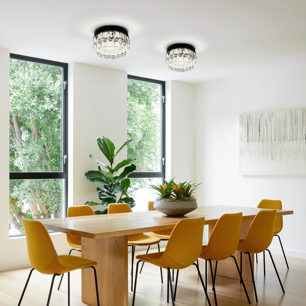 Glacielle: Two round black ceiling lights shown above a dining table