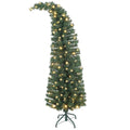 Whimsyglow slim green pre-lit Christmas tree with a bent top and warm white lights