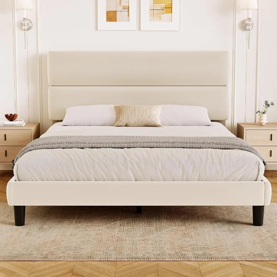 Beige upholstered platform bed with a two-panel padded headboard in a bedroom