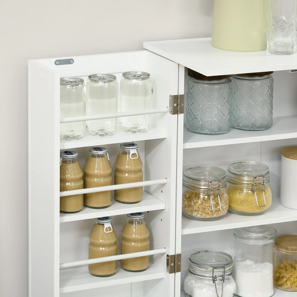 Close-up of white pantry door racks holding bottles beside interior shelves with storage jars.