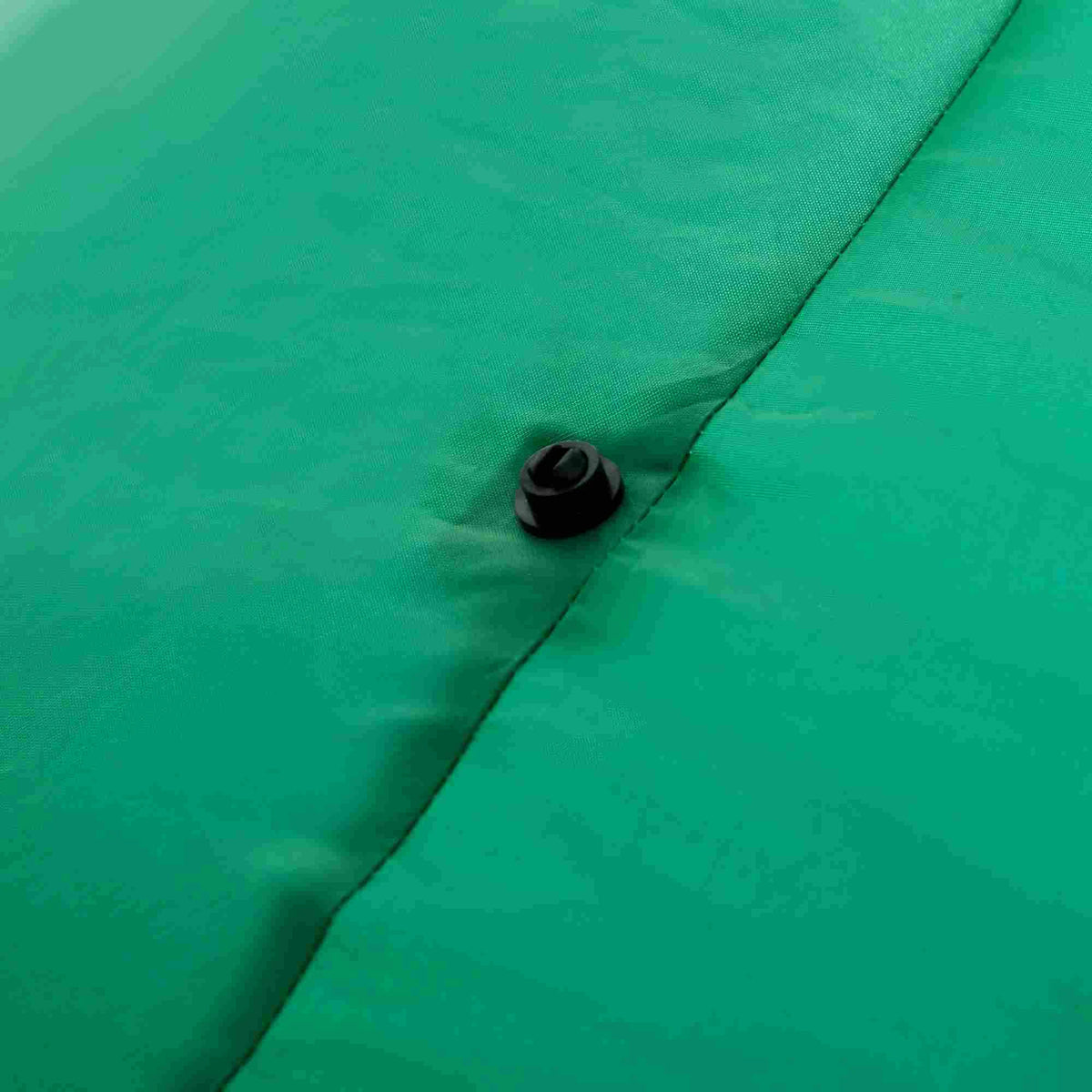 Close-up of the green fabric and attachment point on the Merrysaurus inflatable