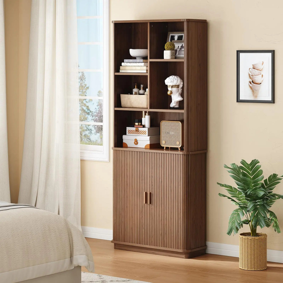 Brown Hushbloom bookcase with open display compartments and fluted lower doors near a window