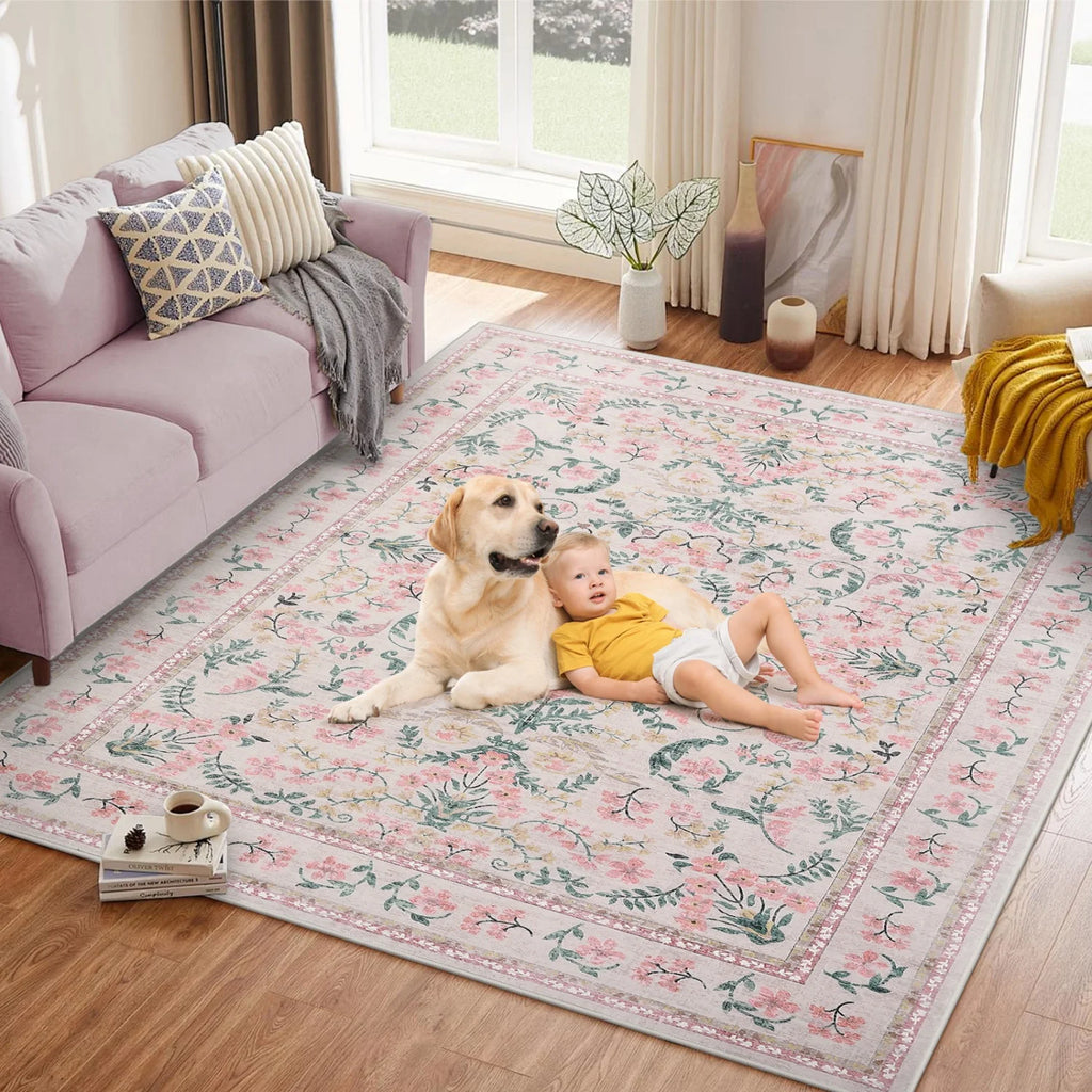 Meadowlark Pink floral area rug shown in a family living space