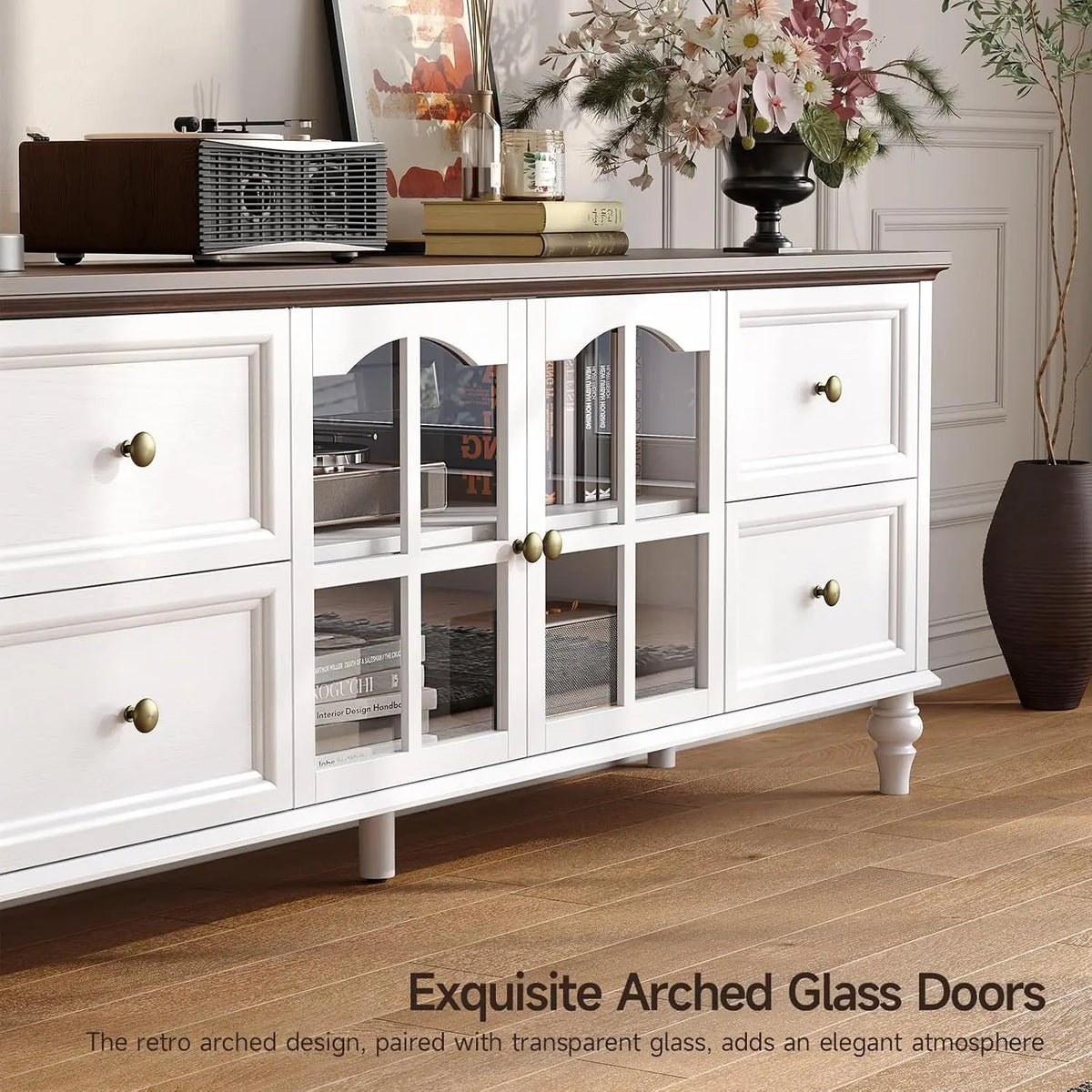 Close-up of Fawnarc White arched glass cabinet doors and round knobs.