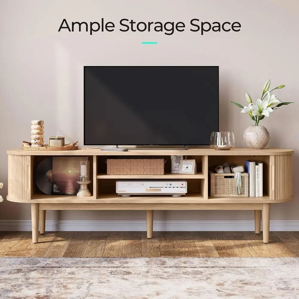Wenselle TV console with sliding fluted doors open to reveal central shelving
