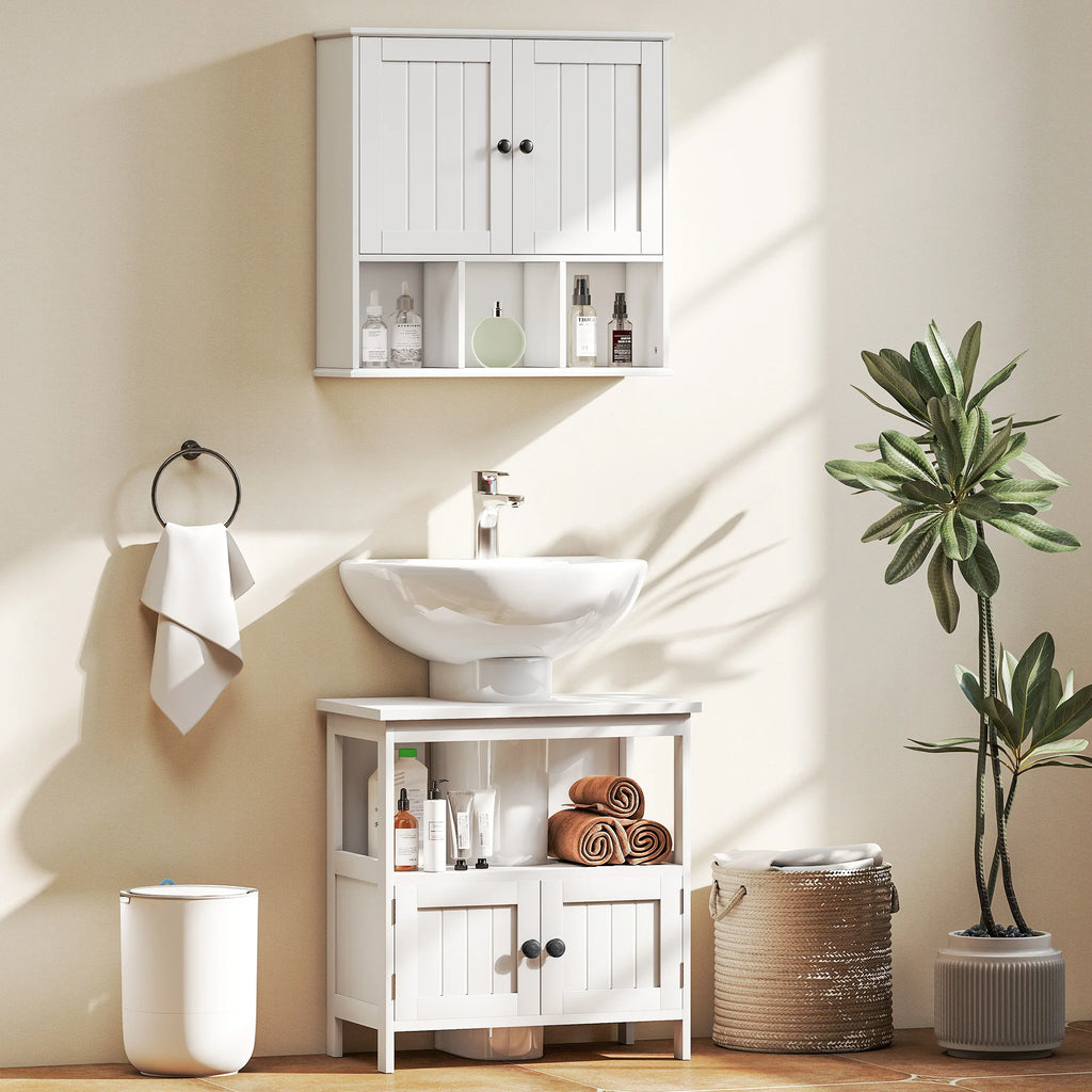 White Kleankin under-sink cabinet in a bathroom scene with a separate wall cabinet and decorative accessories