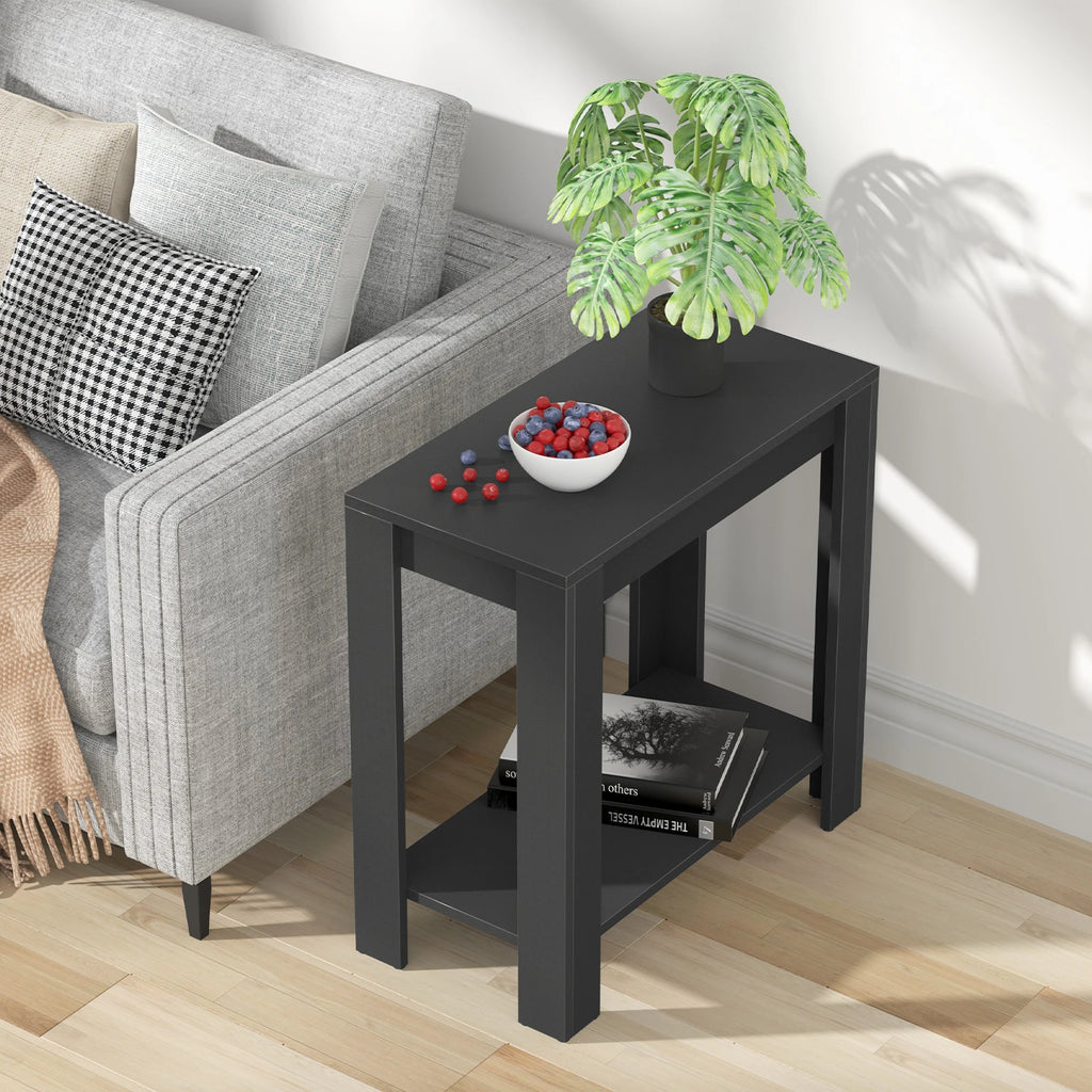 Angled view of the Rhapsodylark black side table with a plant and fruit bowl on top and books below.