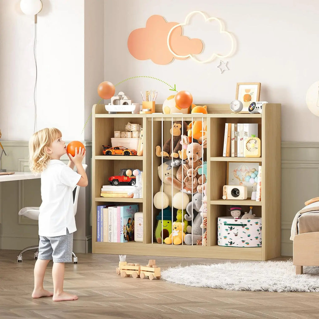 Child placing a ball into the open top of the Light Yellow organizer’s central toy compartment.