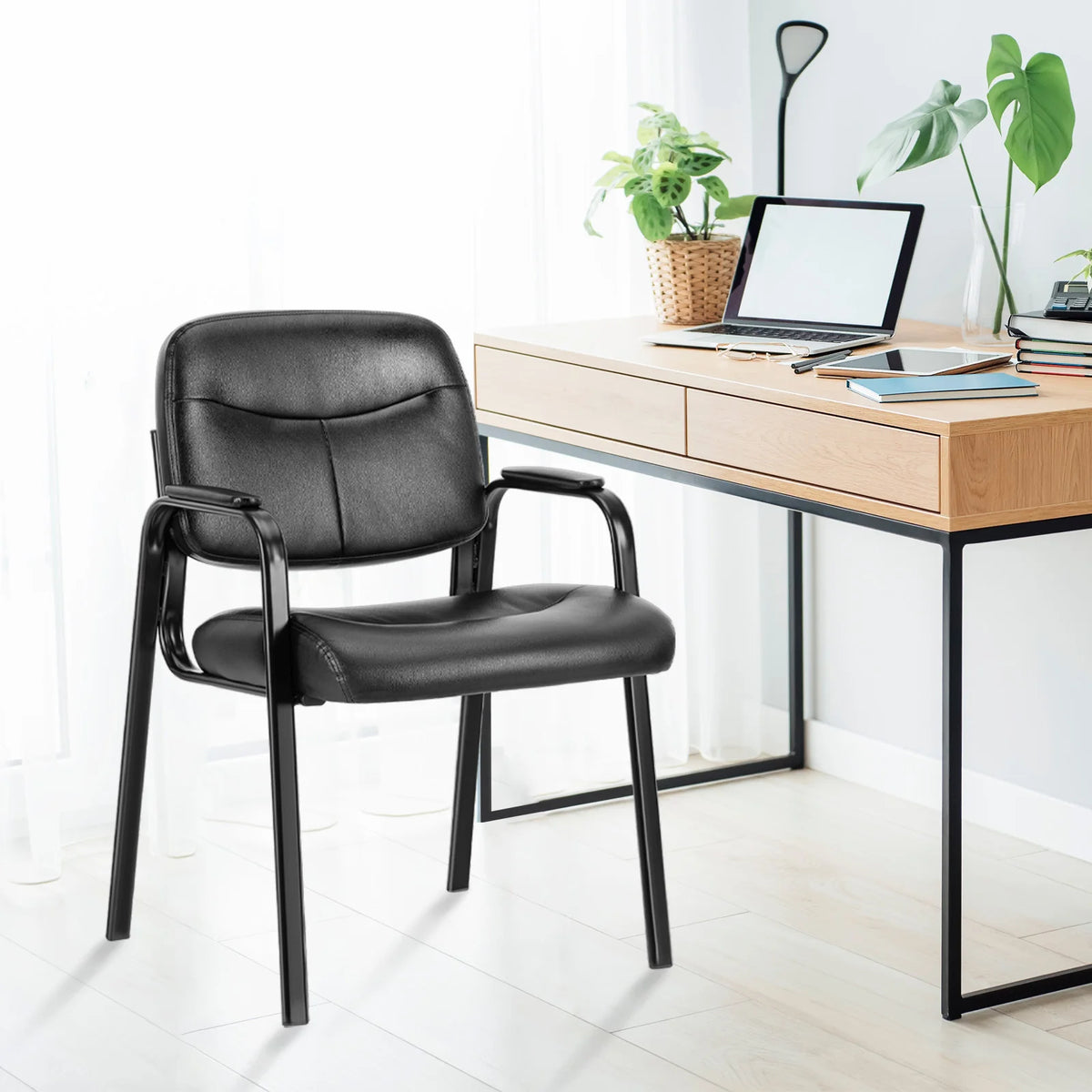 Rippleloom black PU leather guest chair in a home office