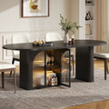 Duskhalo Black oval table with illuminated glass-front storage and fluted supports.