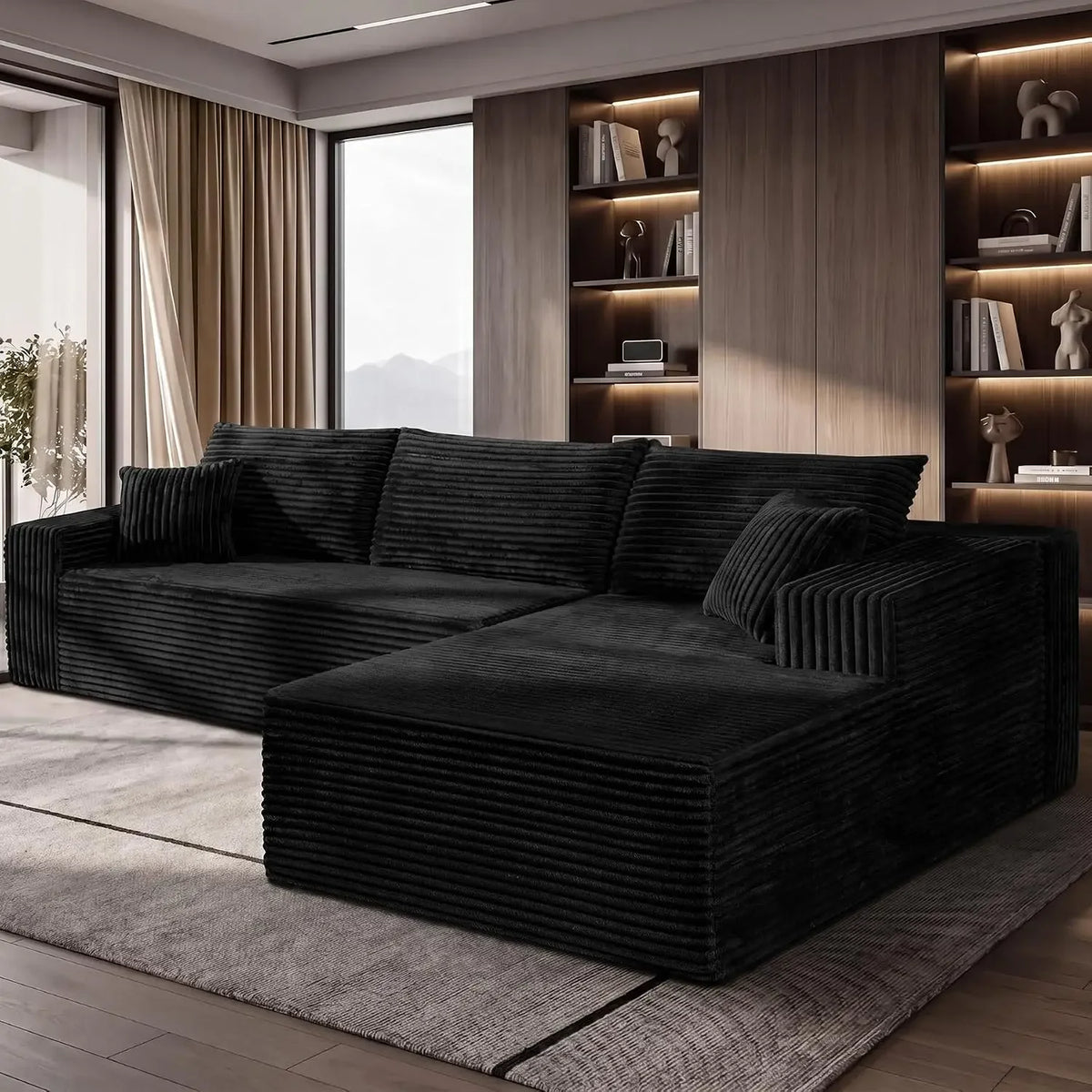 Sablewynn black corduroy sofa with padded back cushions and extended chaise