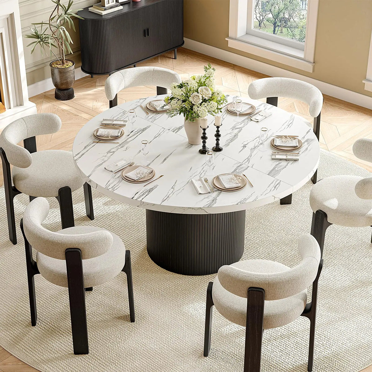 Elevated view of the Duskwhisper marble-texture round table with a black fluted pedestal, styled with six chairs.
