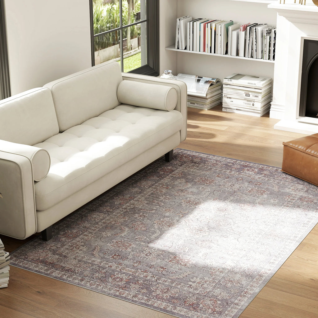 Sagerise area rug styled beside a cream sofa