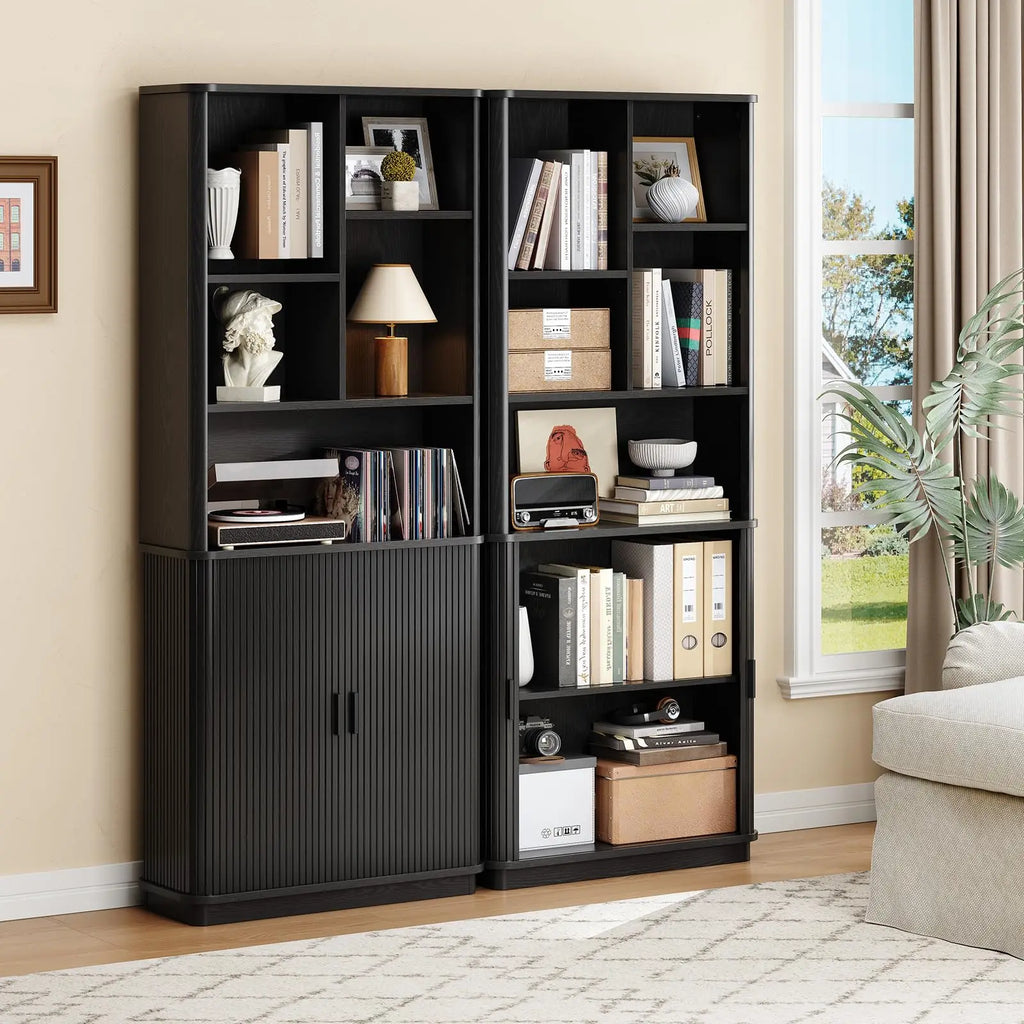 Two Black Hushbloom bookcases styled side by side with open and closed lower doors