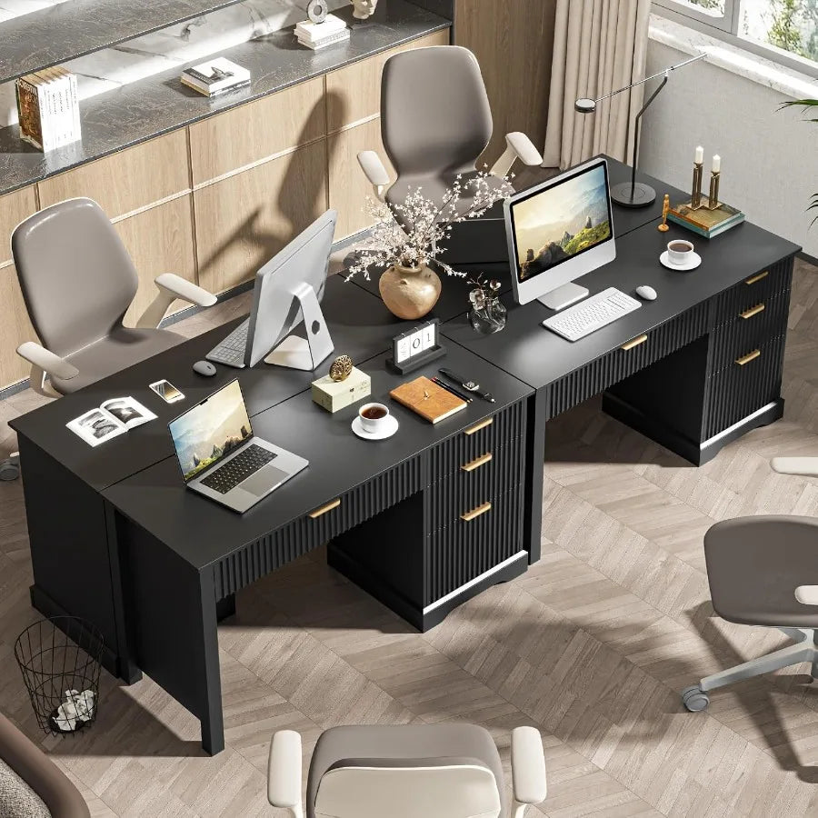 Multiple fluted desks arranged together as separate workstations in an office.