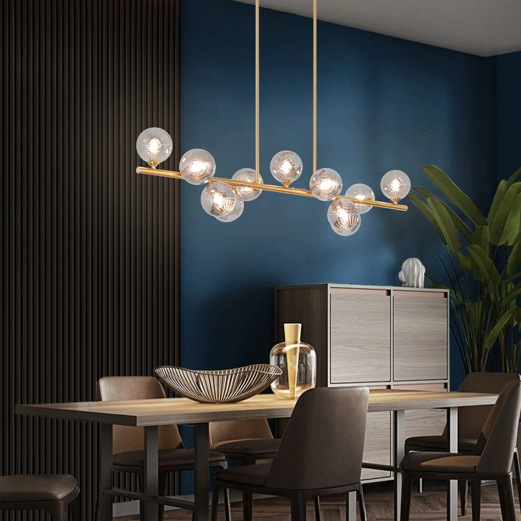 Orbstem striped glass shade and gold-tone metal details shown close up.
