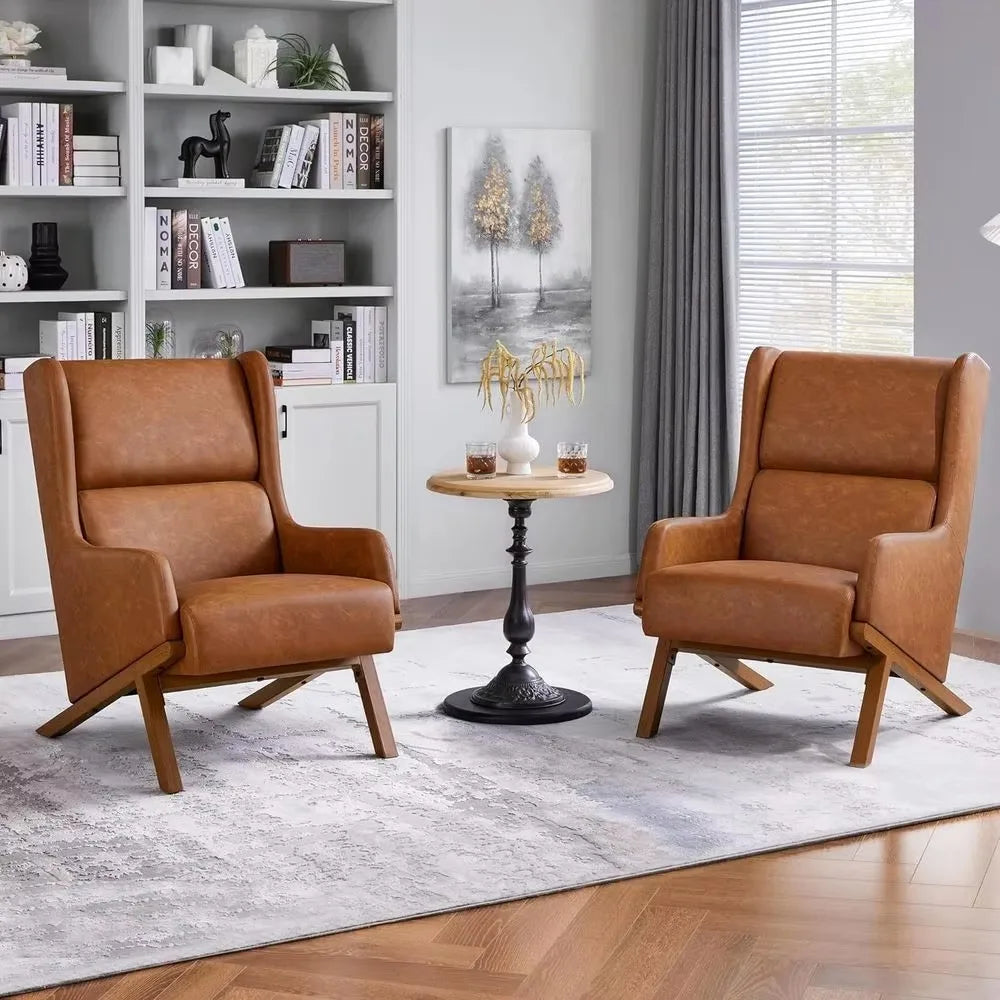 Two cognac brown PU faux-leather Brondelle wingback accent chairs in a living room