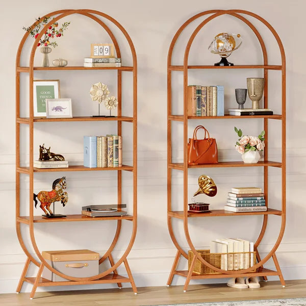 Two wooden bookshelves in a room with decorative items and a plant.