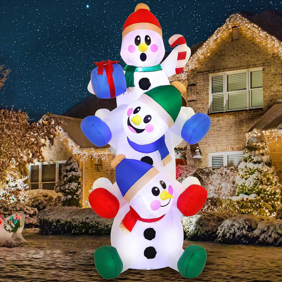 Snowtumble three stacked snowmen with colorful winter accessories, a gift and candy-cane details.