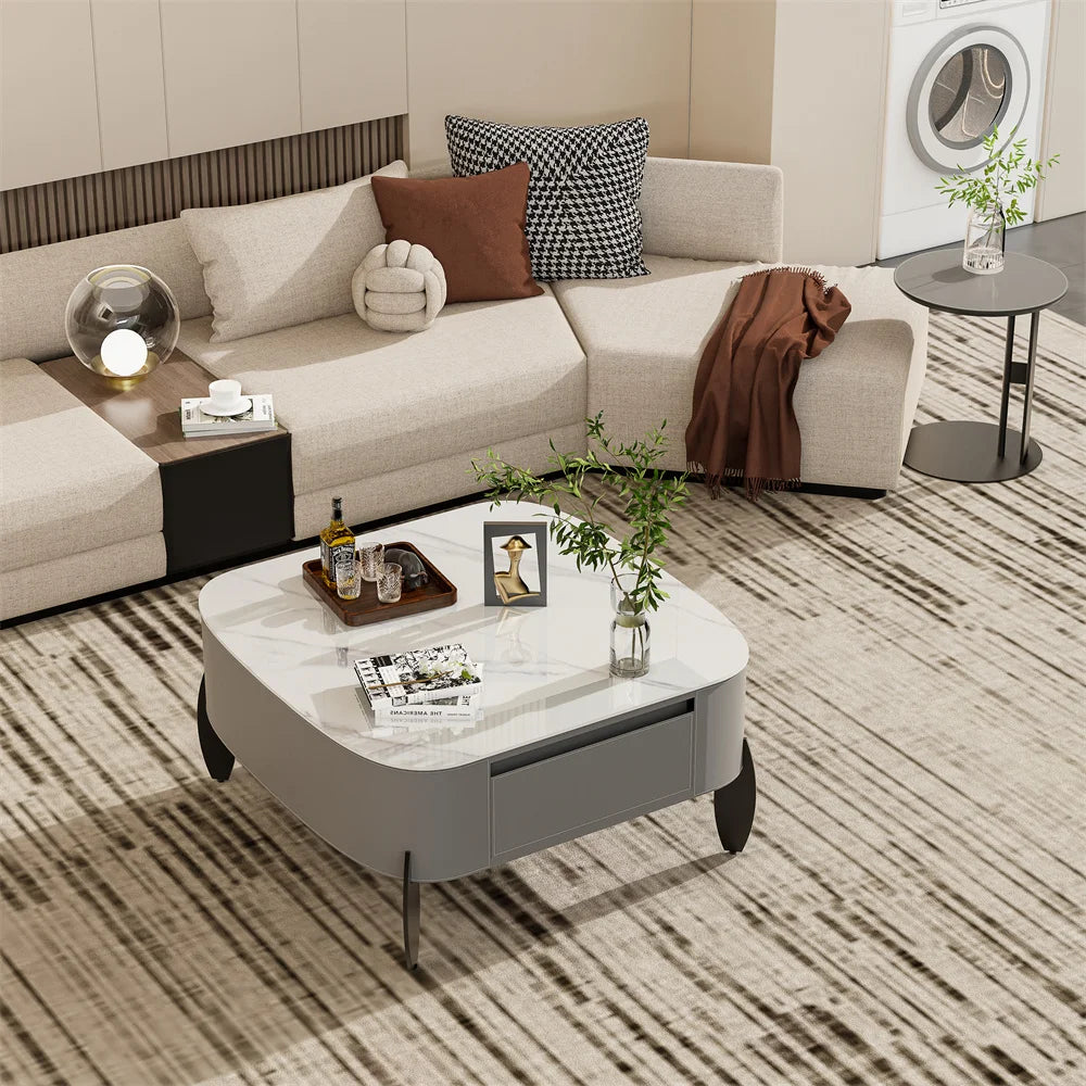 Cinderloom coffee table centered in a living room with a light-colored sectional