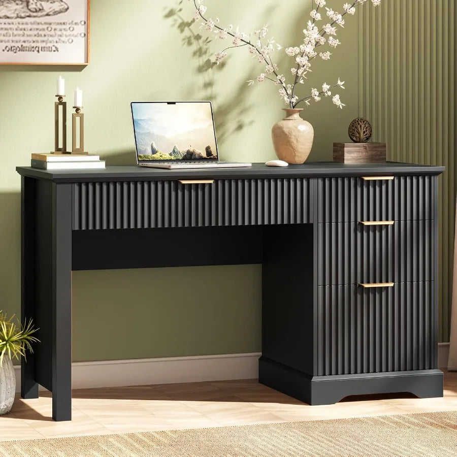 Black fluted desk with gold-tone pulls, a wide center drawer and three right-side drawers.