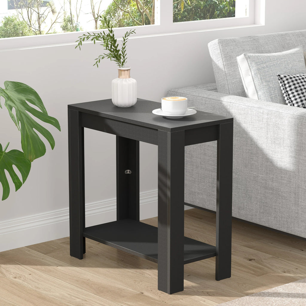 Rhapsodylark black two-tier narrow side table beside a gray sofa, with a vase and cup on top.