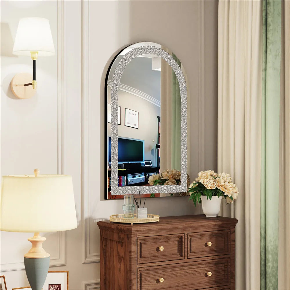 Decorative mirror with a wooden dresser and lamp in a room setting