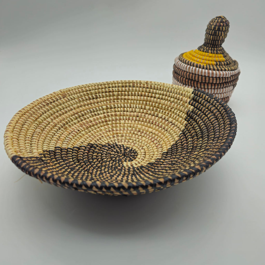 Black Senegalese handwoven shallow basket with coordinating lidded basket