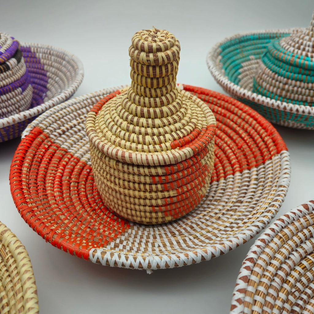 Orange Senegalese handwoven basket set with coordinating lidded basket