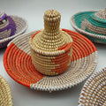Orange Senegalese handwoven basket set with coordinating lidded basket