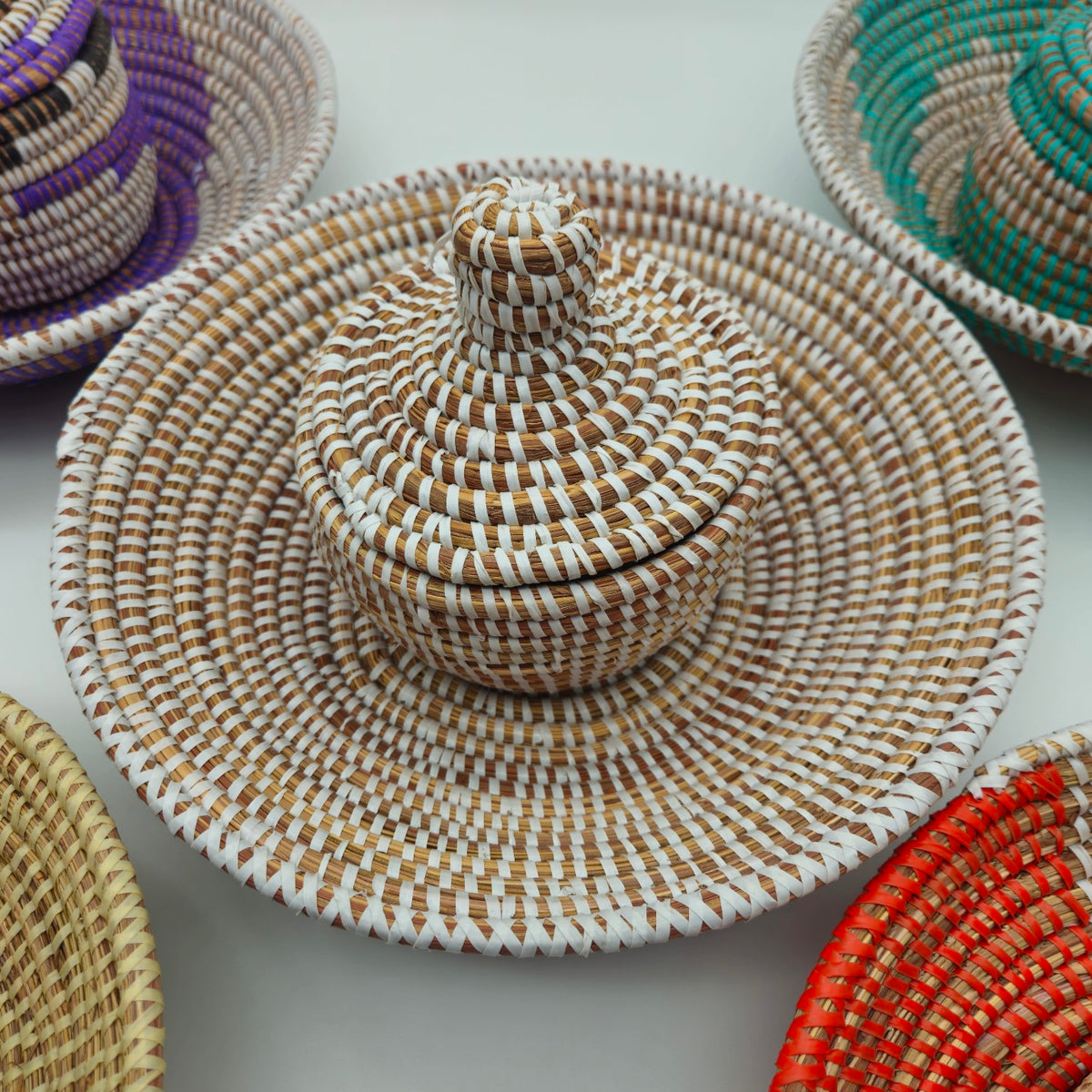 White Senegalese handwoven basket set with coordinating lidded basket